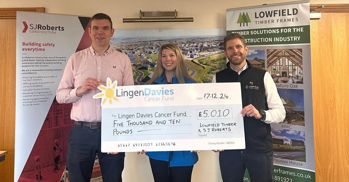 Darren Jarman and Mike Sambrook handing over a cheque to Steph Smith from Lingen Davies